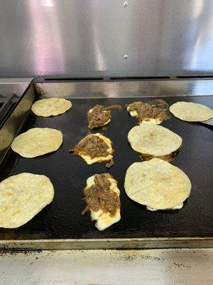 Doritacos. It has birria and cheese with a corn tortilla.