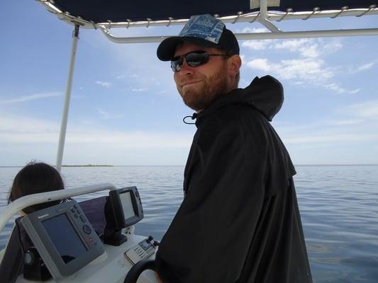 Captain Matt at the helm of the Gray Fox II.