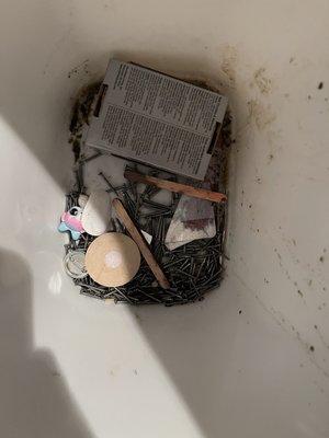 A box of flooring nails this moving company dumped out into an open trash can, along with some of my kids' toys.