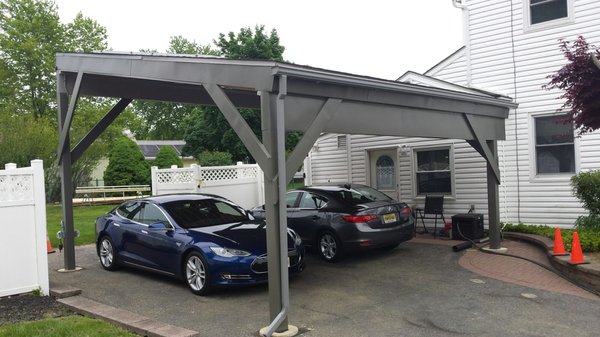 Solar carport done.. TESLA taking advantage