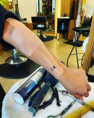 Kinesiotaping is helpful for forearm and elbow pain. Here, a hair stylist had a quick taping so as to help her get thru the work day.