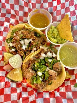 Lengua/ Beef Tongue and Suadero/Brisket tacos Fresh made guacamole, mild green and primo salsa.