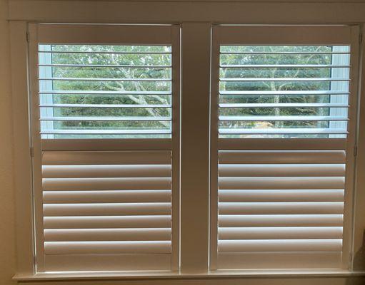 Bedroom Plantation shutters with separate levers so you can open only 1 section if wanted.