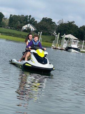 Jet ski, two riders, idle jet ski