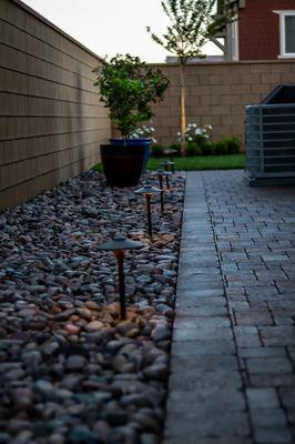 Outdoor lighting sets the ultimate relaxation mood.  we used Vista lighting with Belgard Pavers.