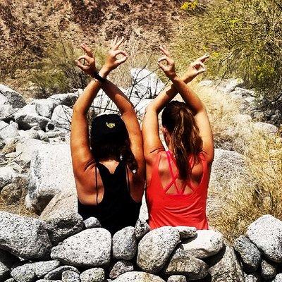 Cassidy and Christina meditating in the Desert