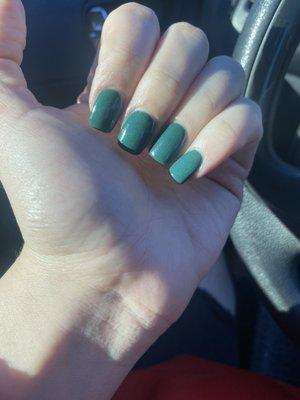 Dark green manicure