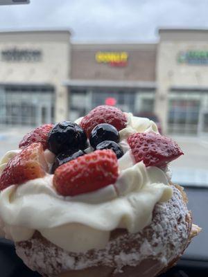 Favorite item =Cream cheese cronut with fresh strawberries and blueberries on top.