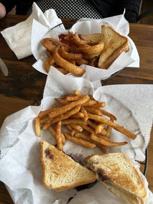 Two grilled cheese with sides