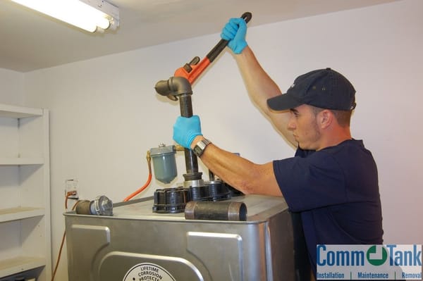 Installation of a Roth heating oil tank in a basement.