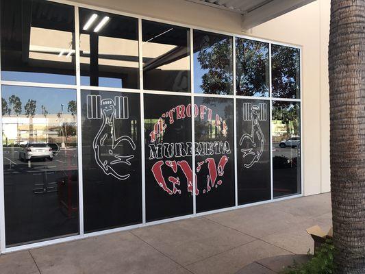 Perforated window for a local gym.