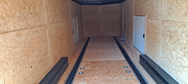 Enclosed services offered. 2 car trailer