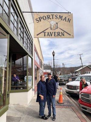 New sign and storefront with one of the owners, Dan Withrow