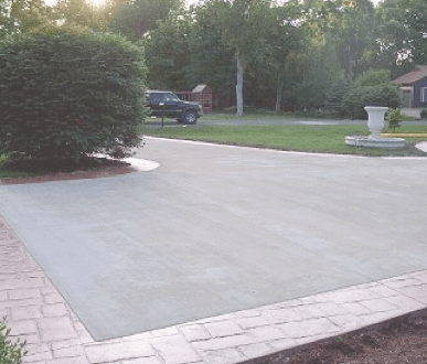 Concrete Contractors Godfrey IL - Concrete driveway with stamped concrete border.