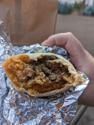 Steak super burrito with pinto beans