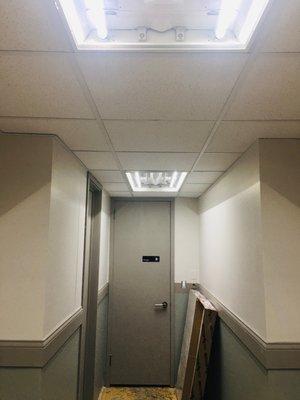 Installation of commercial lights, electrical wires, ceiling tiles drywall/paint