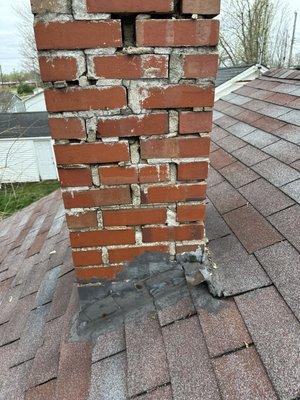 Traditional masonry chimney that was demolished and replaced with new metal chimney pipe