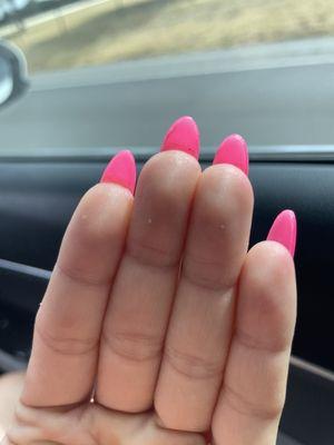 Natural nails not trimmed back on this hand and clumps under nails