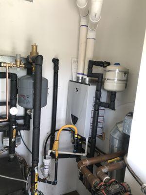 Tankless install tanked water heater removal