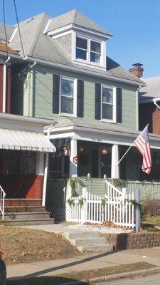 Beautiful traditional townhome with a fresh green paint job