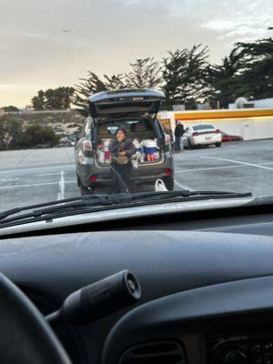 Lady selling food out of her car seaside Home Depot