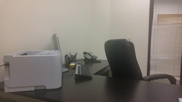 Office, undecorated so that maximum funds go directly to defending clients.