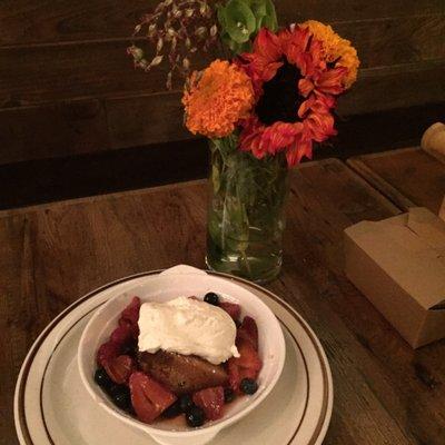 Cream Cheese Poundcake with macerated berries and fresh whipped cream. Pretty flowers on the table!