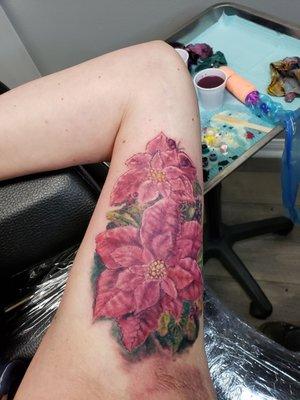 Poinsettias on my inner bicep to cover a long scar I have and TJ did an amazing job!  I love it!