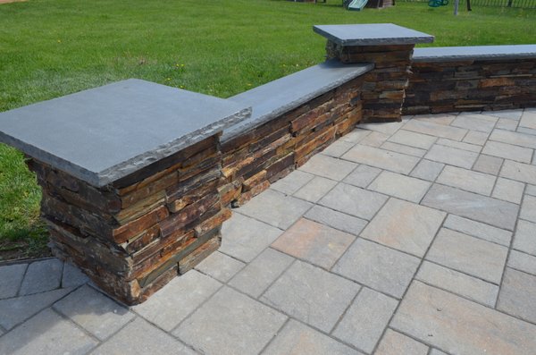 Sitting Wall, featuring natural stone facing with blue stone capping.