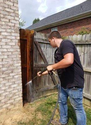 Pressure washing a fence