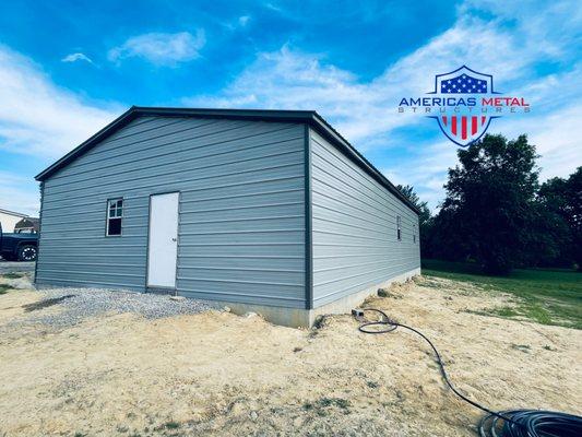 FINALLY FINISHED PRODUCT 30'W X 50'L X 10'H VERTICAL ROOF GARAGE ( BACK VIEW )