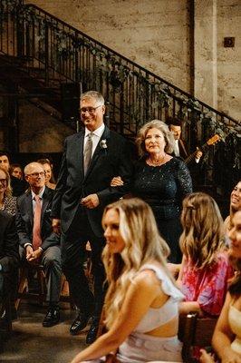 Dylan performing while the parents of the groom walk down the aisle. Luce Loft, San Diego, CA. Angela Nicole Photography.