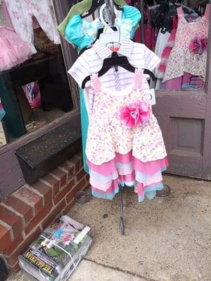 Children's clothes and Polish pottery.