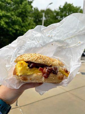 Sesame bagel with egg, cheddar and bacon