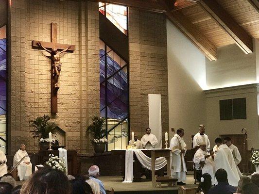 Bishop Calvo ordaining a new priest