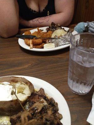 My daughter had the flat iron steak with fried shrimp and a baked potatoe with butter and sour cream