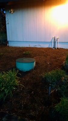 2500 gallon Reservoir system on a low yielding well . I riser was installed above ground level to keep ground water out.