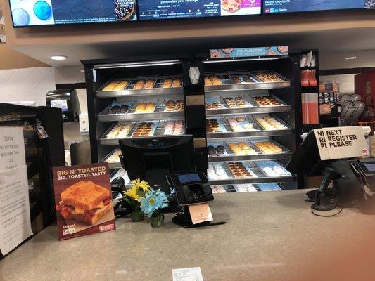 Morning donuts just placed fresh on the rack