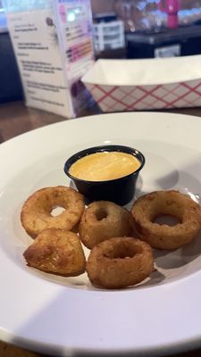 Onion rings with rose petal sauce.