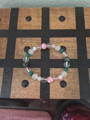 Morganite, Emerald, Rose Quartz, Rhodochrosite, Citrine, Malachite, and Clear Quartz.