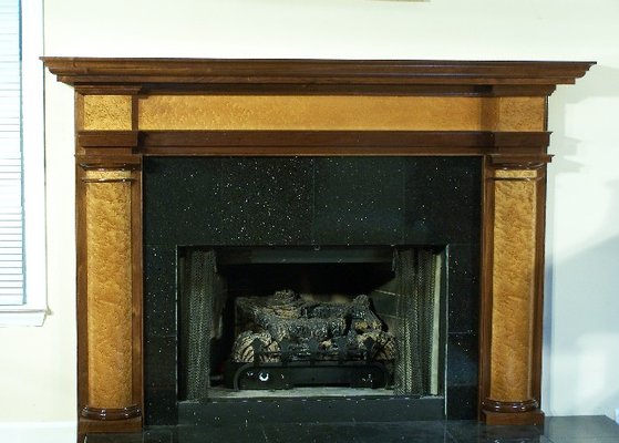 Custom fireplace mantel in walnut and bird's eye maple