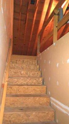 Permanent staircase to spacious 3rd floor attic.