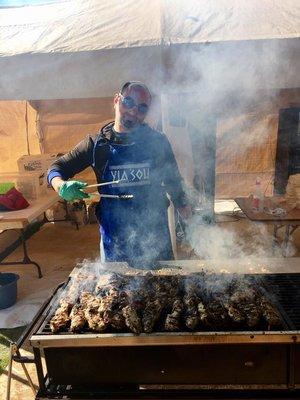 Cooking souvlaki. So much savory smoke, our grill-masters wear goggles!