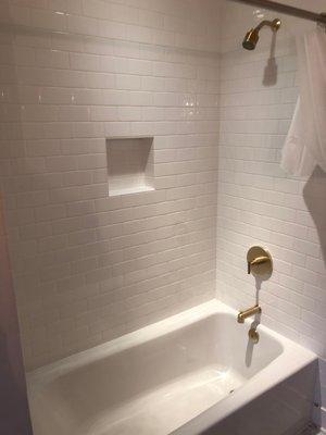 Classic subway tile tub with built in shelf!