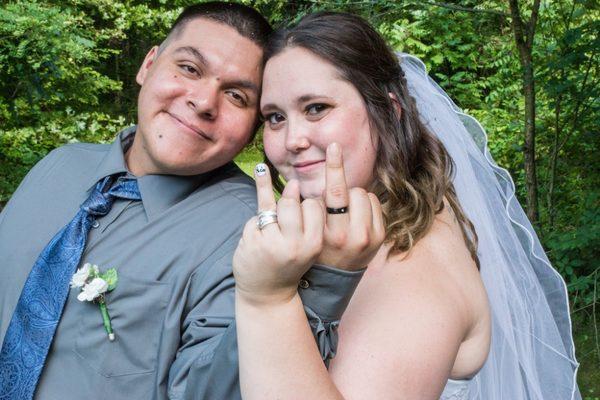 Showing off their wedding rings