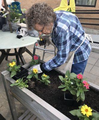 Guests stay active with engaging activities including gardening.