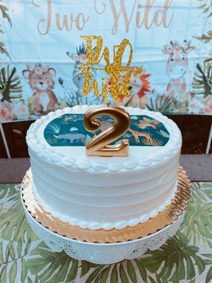 Round cake w/animal design. White cake w/ buttercream frosting & fresh strawberries