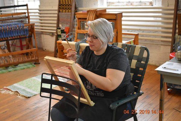 Co-Owner Rachel giving tapestry weaving demonstration