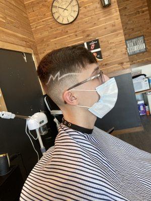 Mid skin fade with design