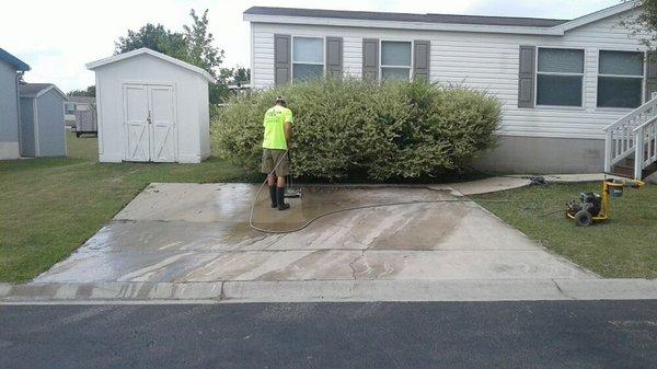 Pressure washing driveway.